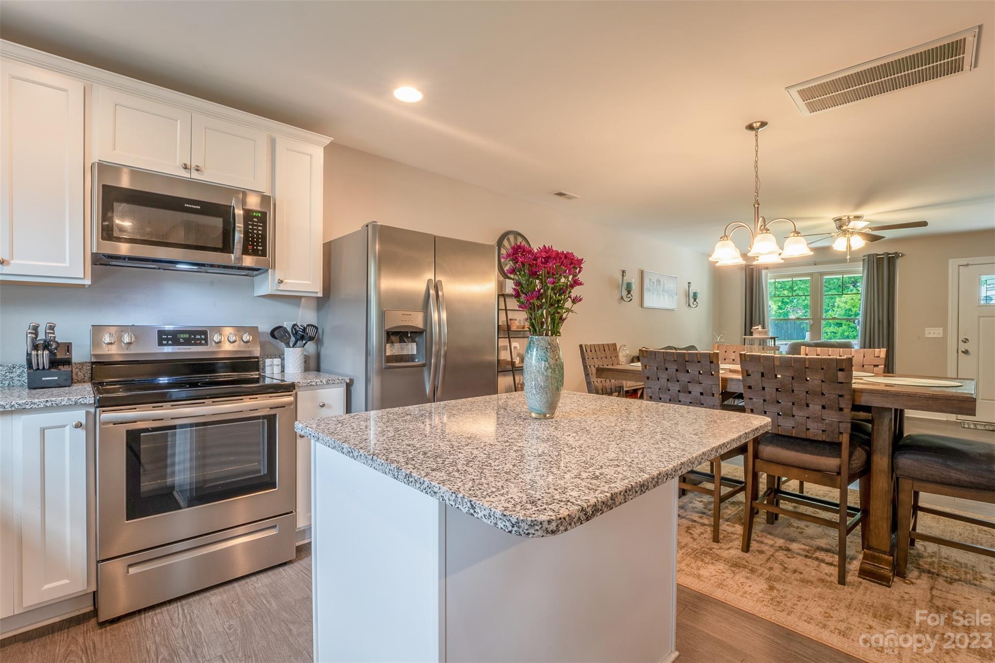 212 Old Centergrove Road Kannapolis, NC 28083 - Photo 13 of 39 a kitchen with stainless steel appliances granite countertop a kitchen island hardwood floor and a sink