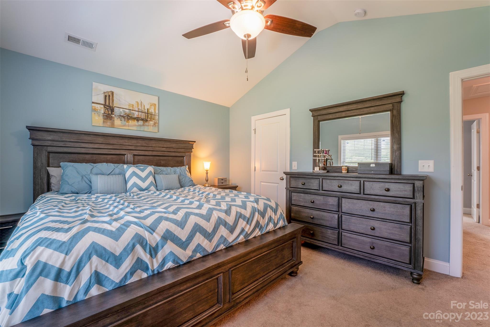 212 Old Centergrove Road Kannapolis, NC 28083 - Photo 27 of 39 a bedroom with a bed and a chandelier
