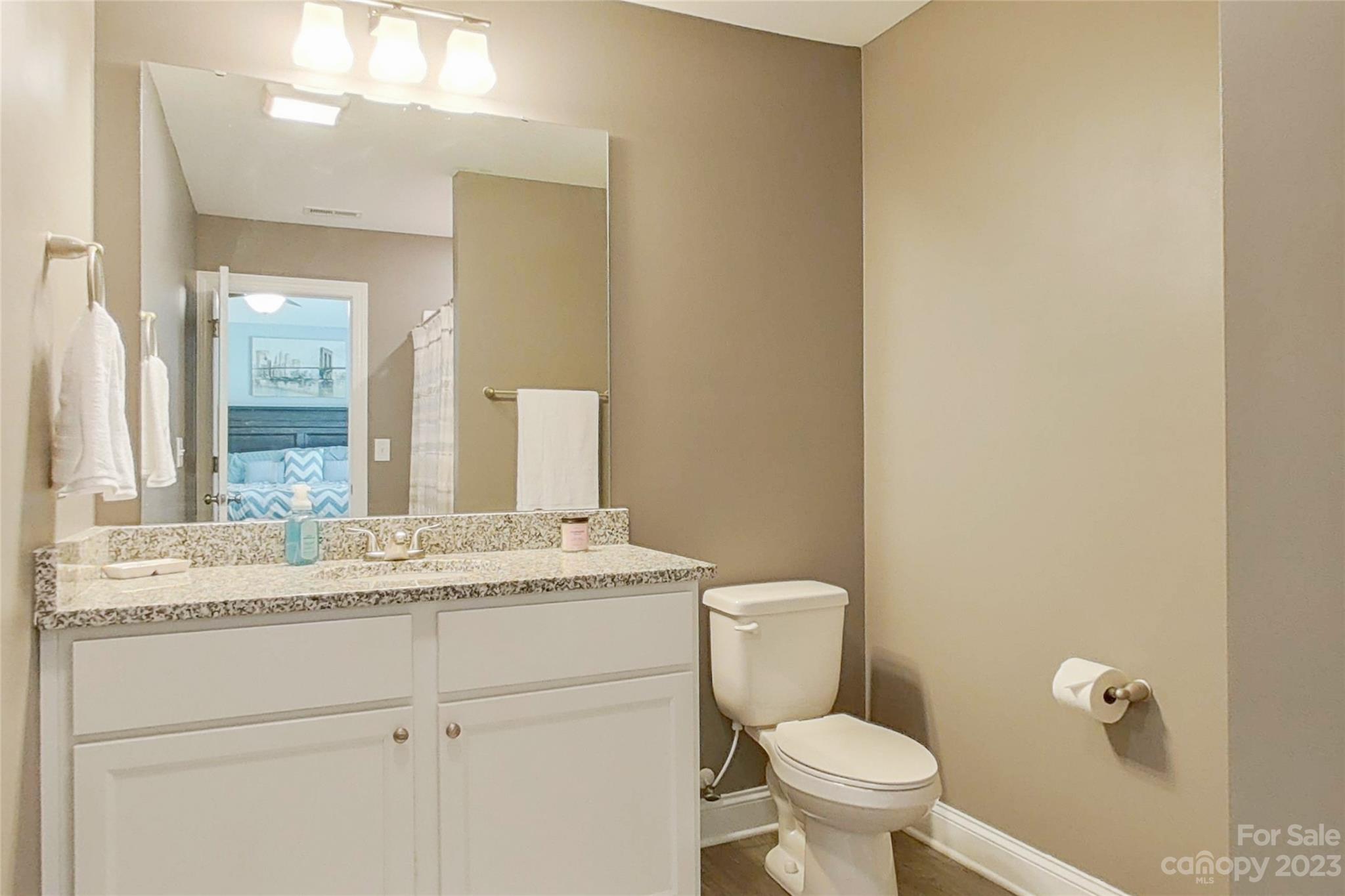 212 Old Centergrove Road Kannapolis, NC 28083 - Photo 29 of 39 a bathroom with a granite countertop toilet sink and mirror