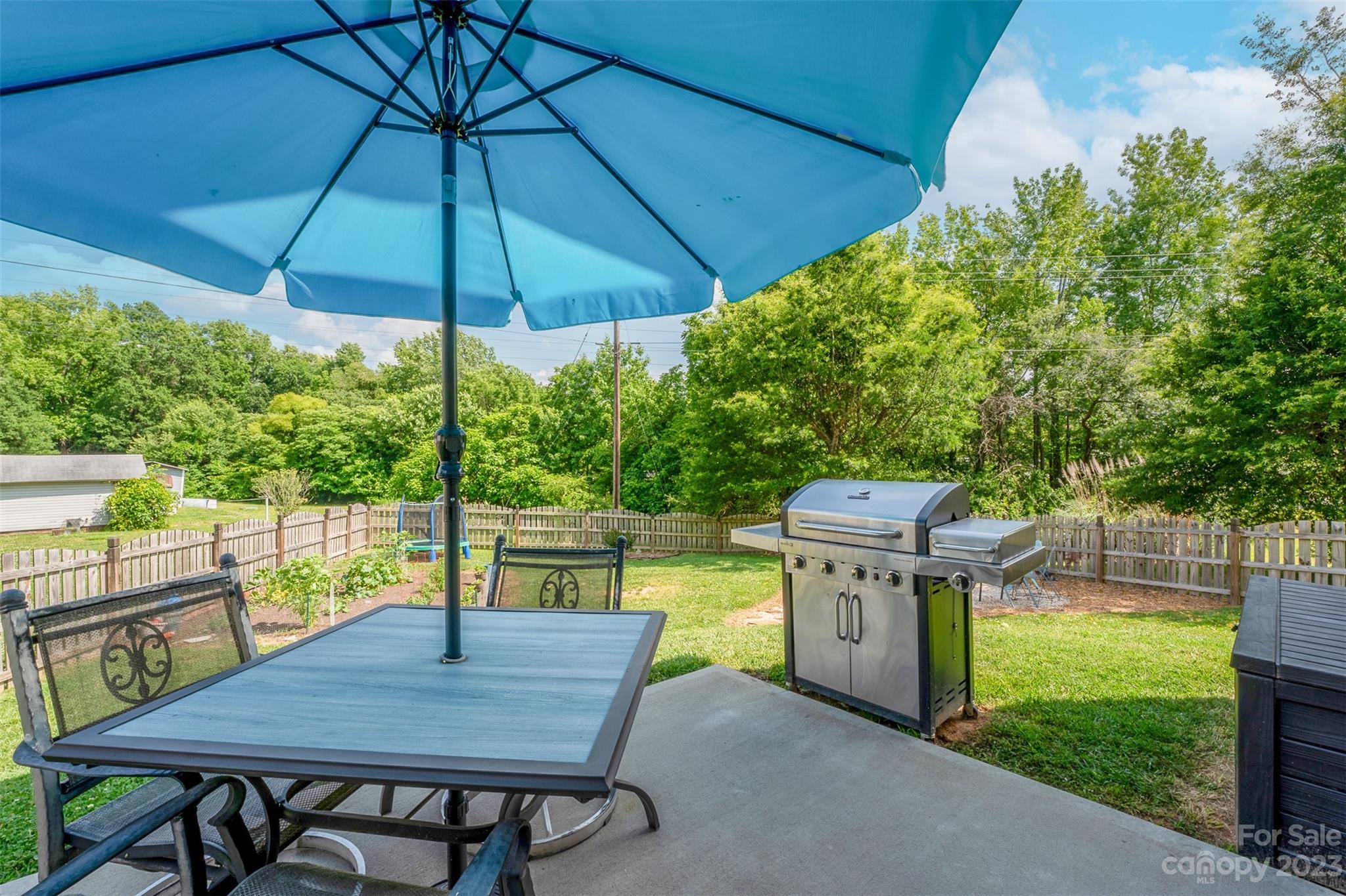 212 Old Centergrove Road Kannapolis, NC 28083 - Photo 30 of 39 a view of a patio with a table chairs and a umbrella