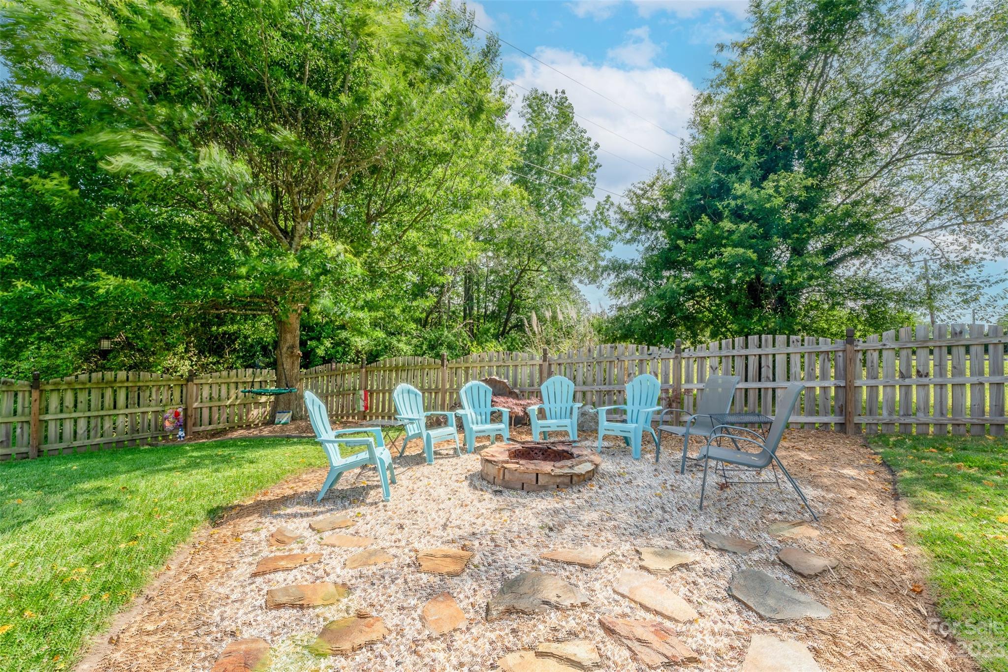 212 Old Centergrove Road Kannapolis, NC 28083 - Photo 31 of 39 a view of backyard with a table and chairs