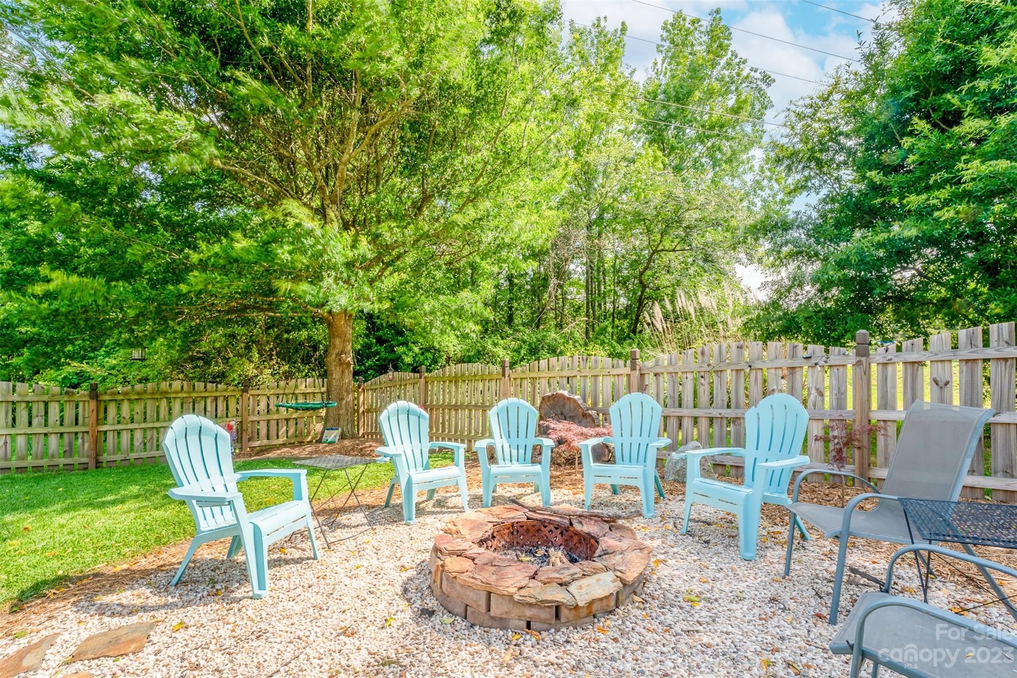 212 Old Centergrove Road Kannapolis, NC 28083 - Photo 32 of 39 a view of a chairs and table in backyard
