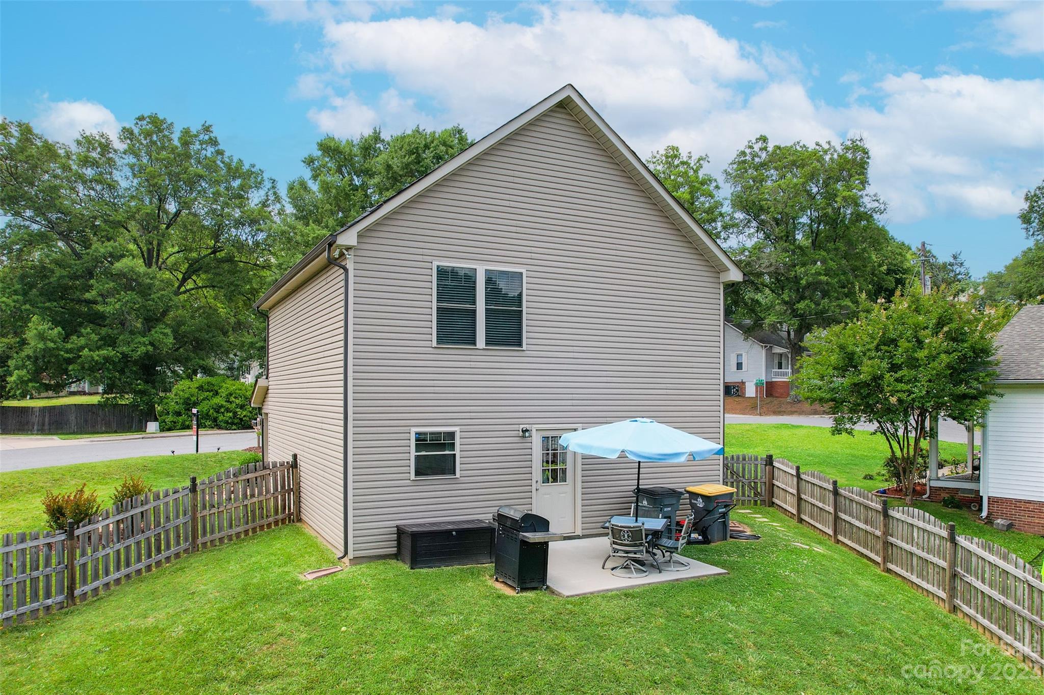 212 Old Centergrove Road Kannapolis, NC 28083 - Photo 34 of 39 a view of a house with backyard sitting area and garden