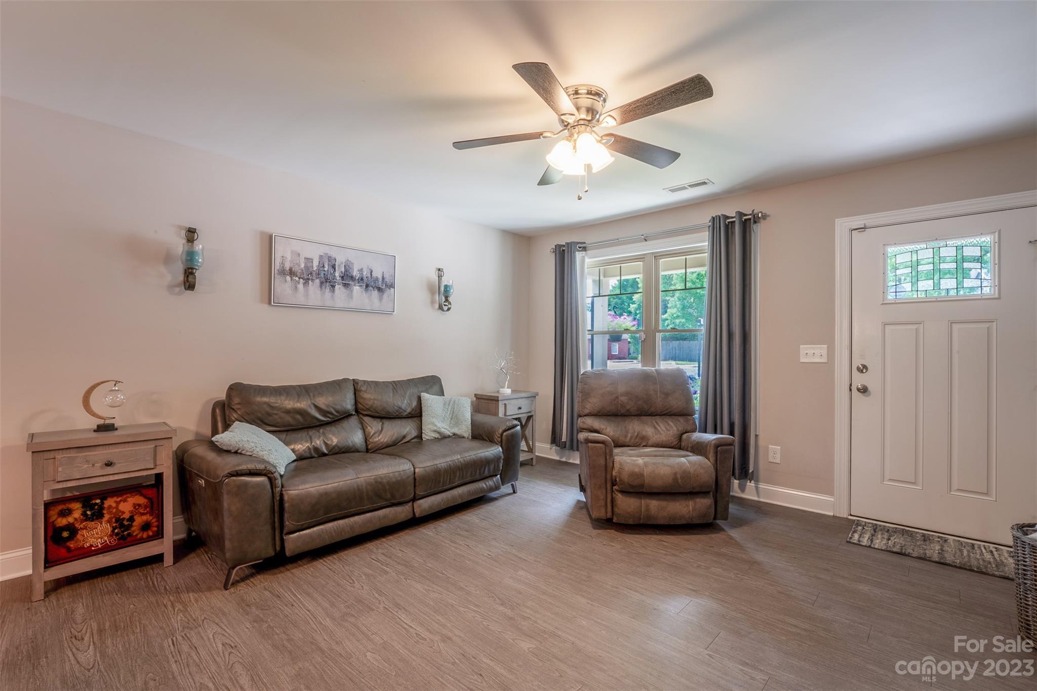 212 Old Centergrove Road Kannapolis, NC 28083 - Photo 5 of 39 a living room with furniture and a flat screen tv
