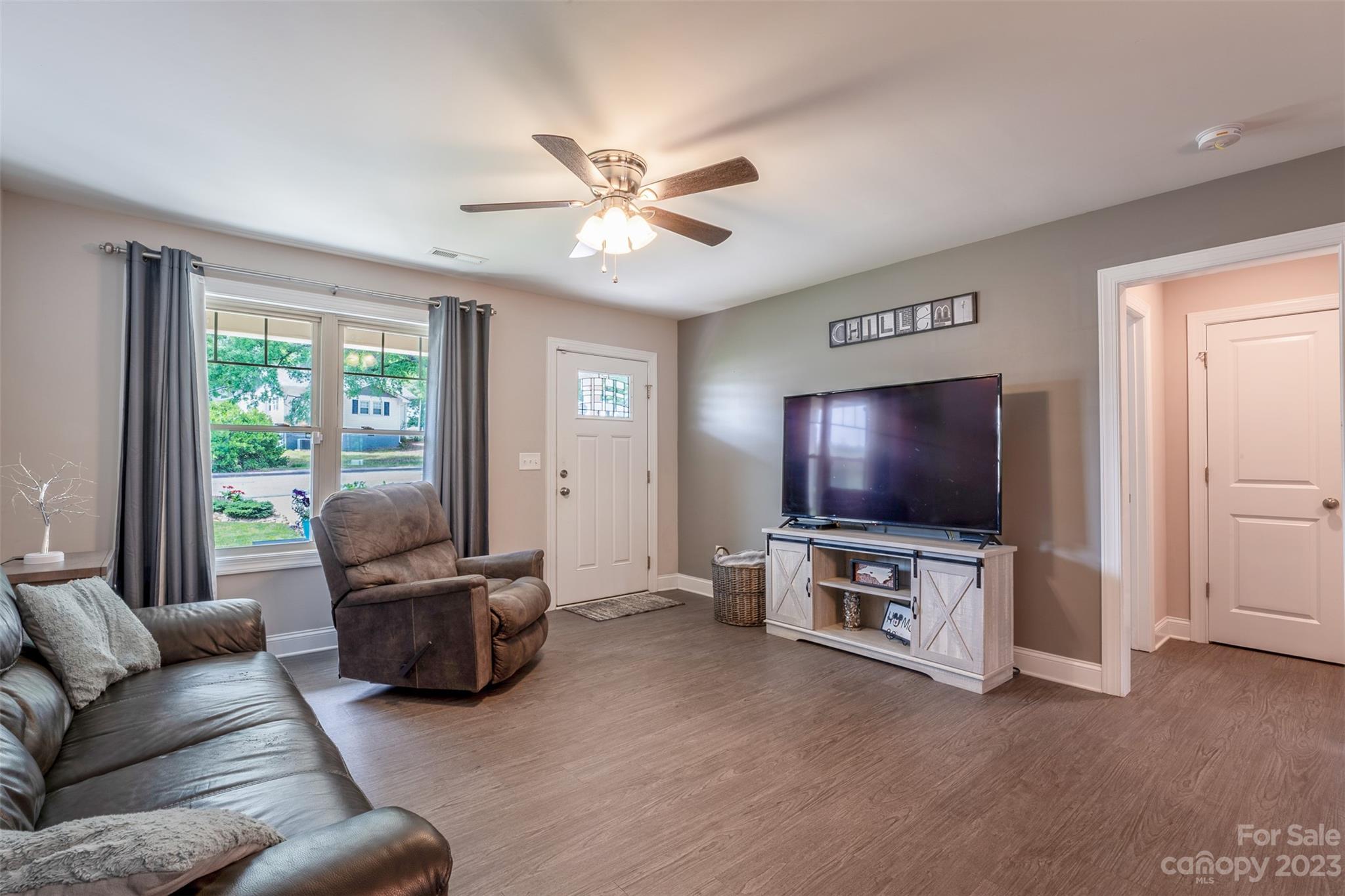 212 Old Centergrove Road Kannapolis, NC 28083 - Photo 6 of 39 a living room with furniture and a flat screen tv