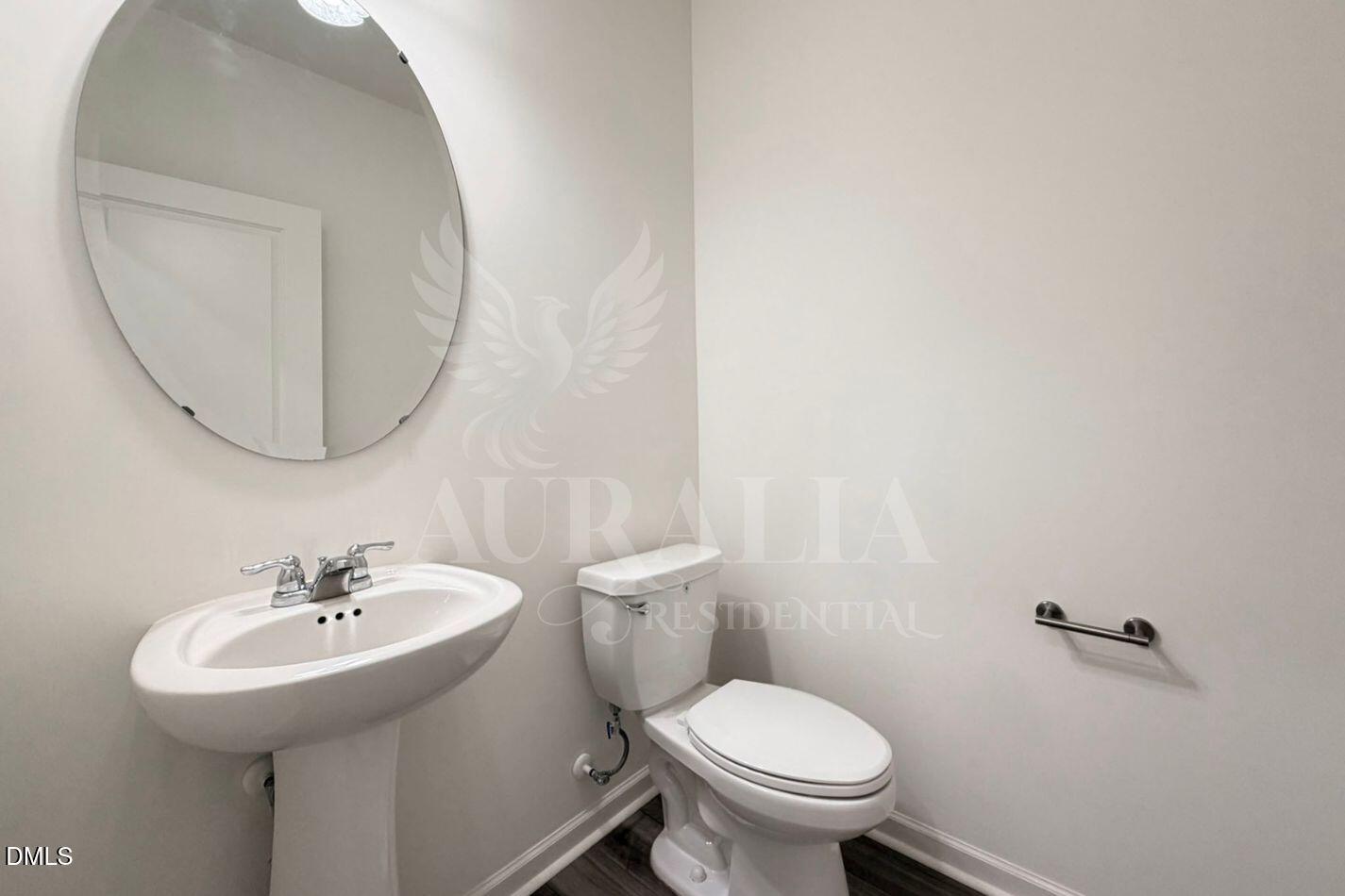937 Berkeley Glen Road Zebulon, NC 27597 - Photo 12 of 35 a bathroom with a sink and a toilet