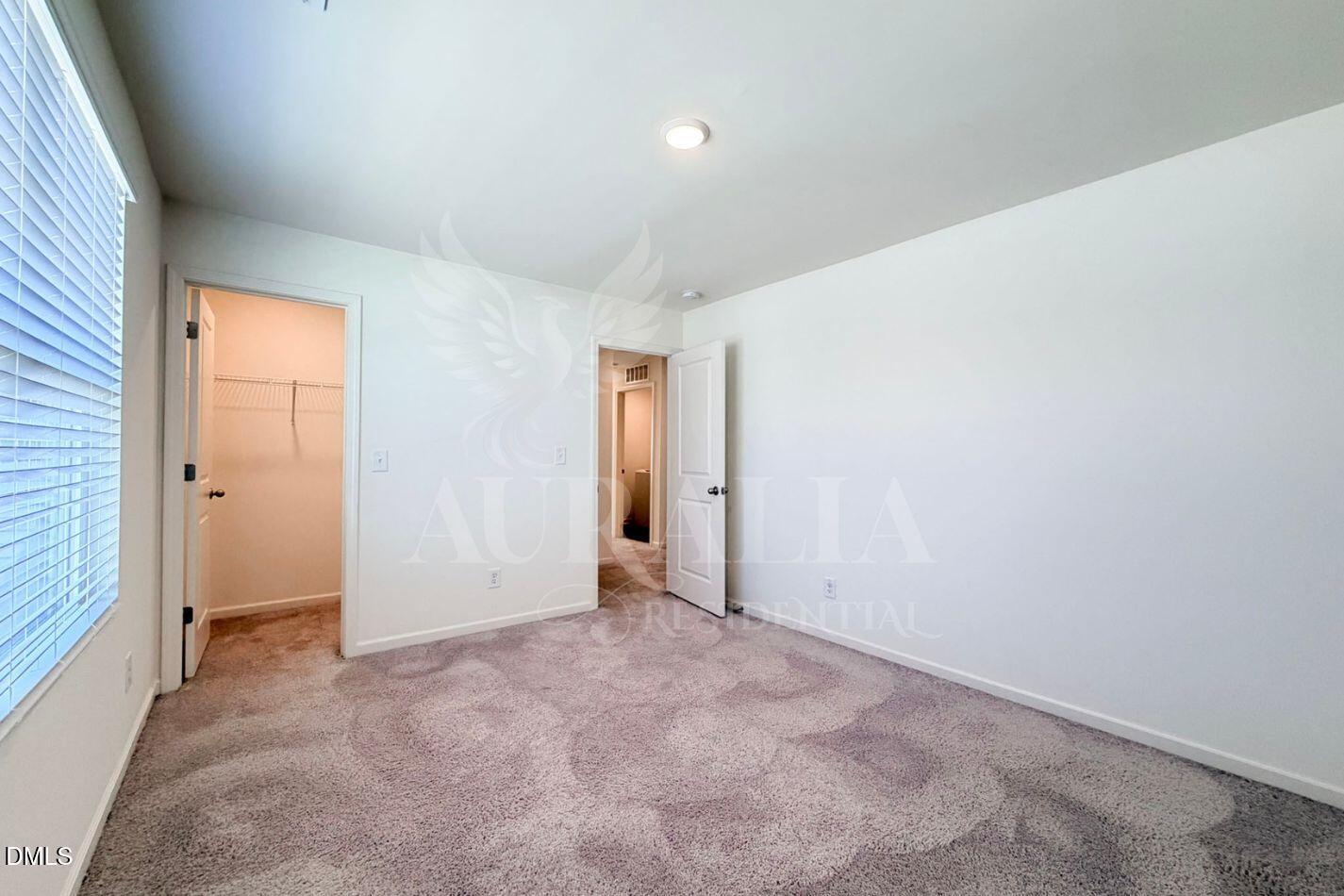 937 Berkeley Glen Road Zebulon, NC 27597 - Photo 18 of 35 an empty room with an entryway