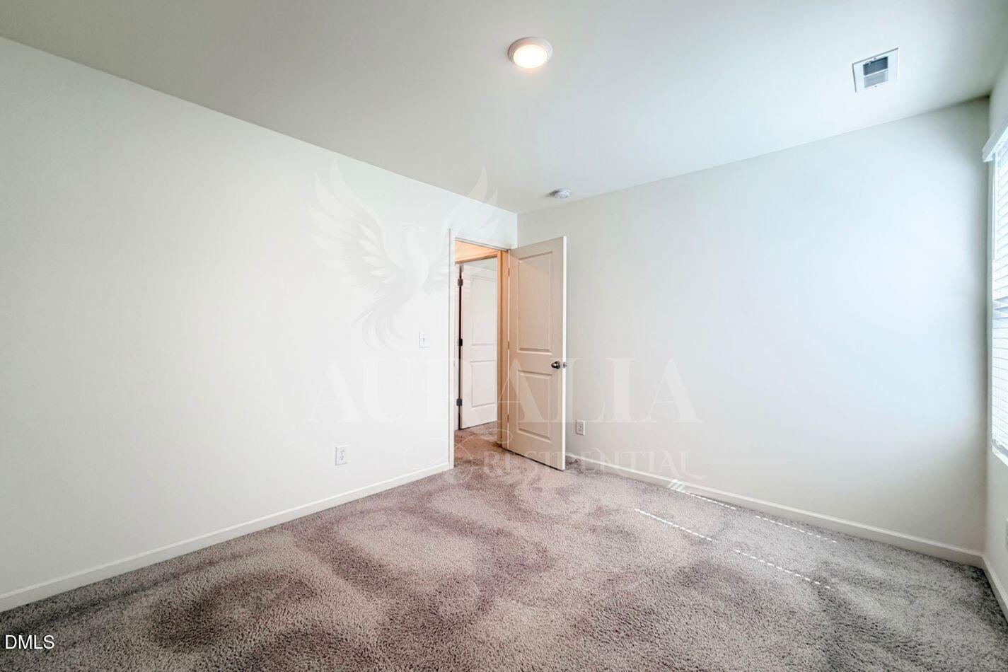 937 Berkeley Glen Road Zebulon, NC 27597 - Photo 24 of 35 a view of an empty room