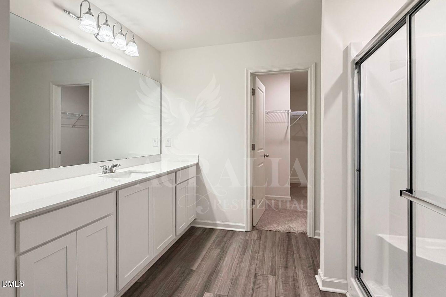 937 Berkeley Glen Road Zebulon, NC 27597 - Photo 27 of 35 a bathroom with a double vanity sink and mirror