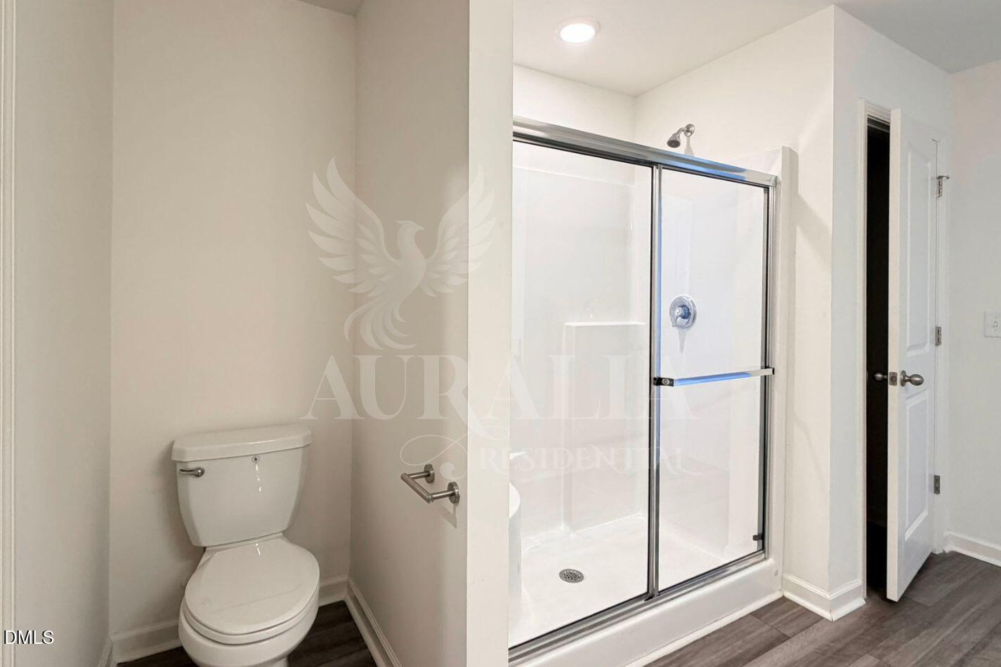 937 Berkeley Glen Road Zebulon, NC 27597 - Photo 28 of 35 a bathroom with a toilet and a shower