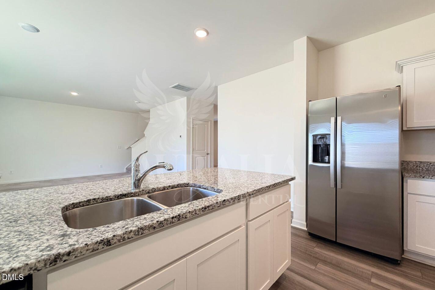 937 Berkeley Glen Road Zebulon, NC 27597 - Photo 9 of 35 a close view of a sink and refrigerator