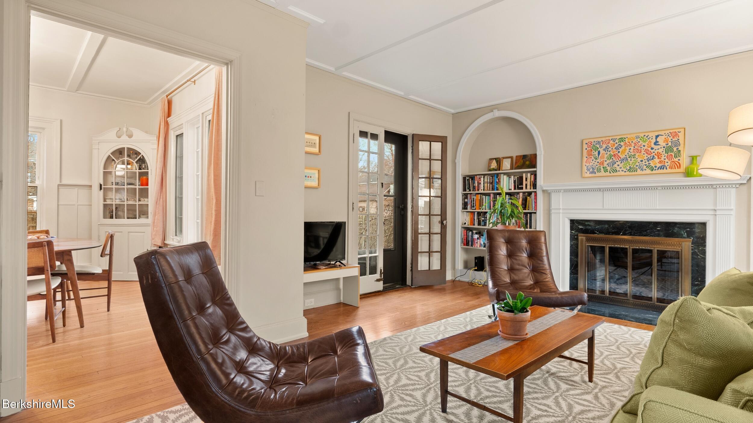 69 Commonwealth Avenue Pittsfield, MA 01201 - Photo 11 of 40 a living room with furniture and a fireplace