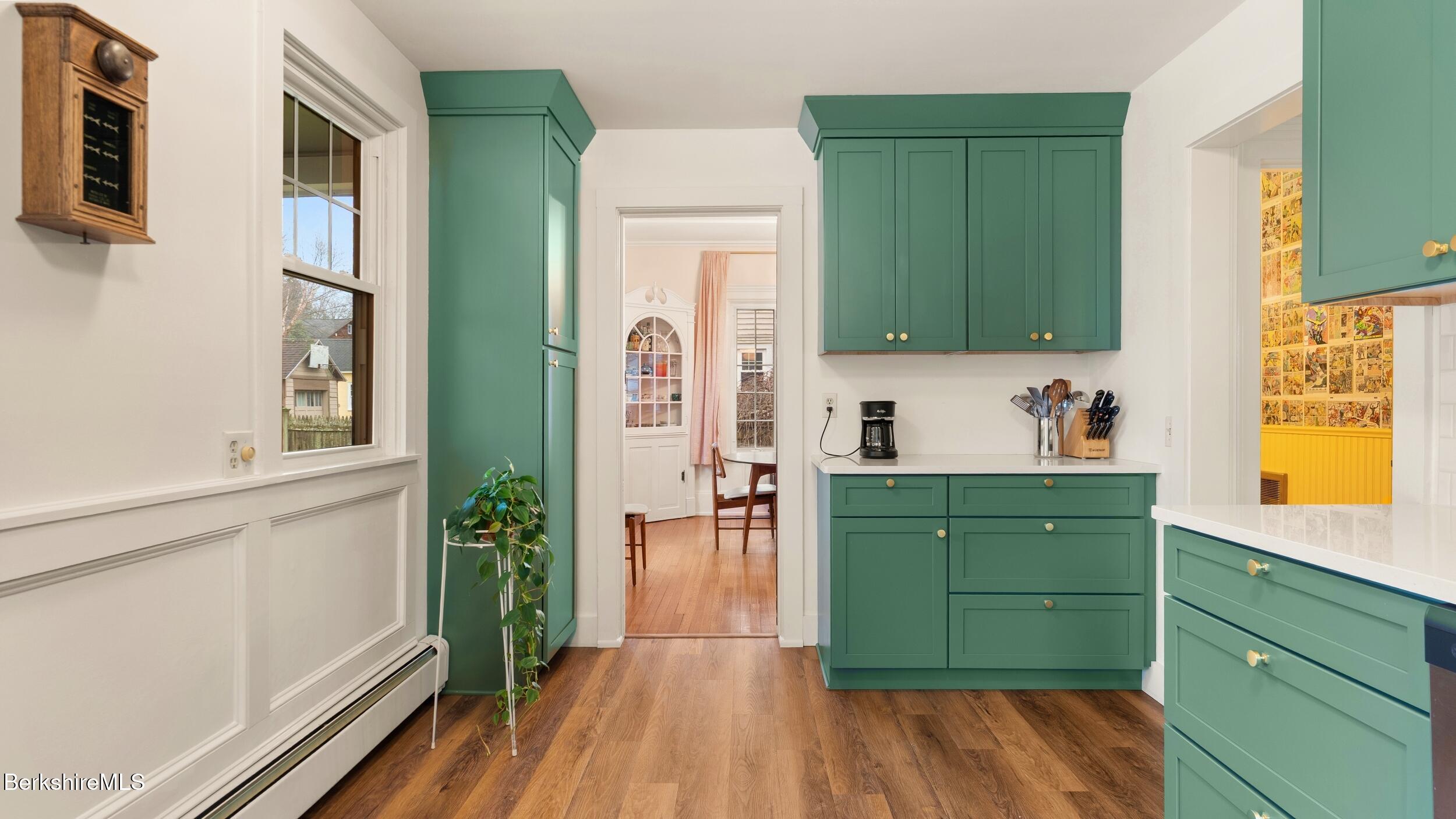 69 Commonwealth Avenue Pittsfield, MA 01201 - Photo 16 of 40 a kitchen with cabinets and wooden floors