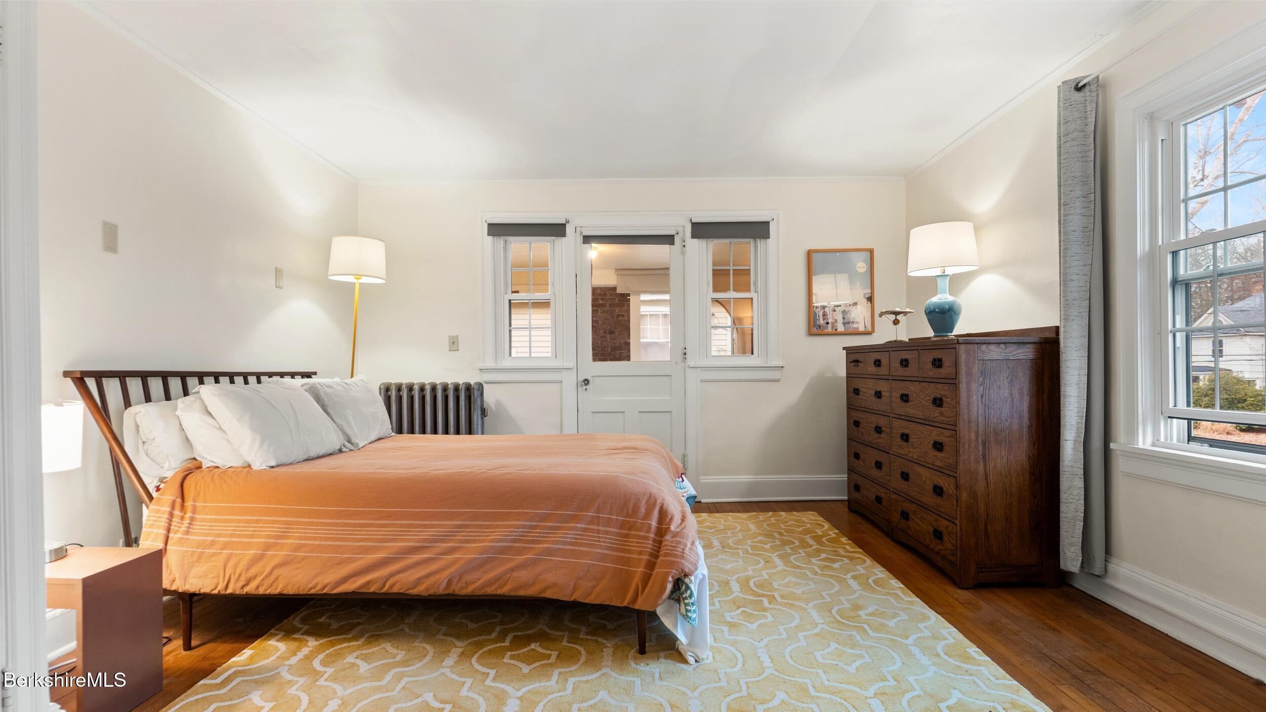 69 Commonwealth Avenue Pittsfield, MA 01201 - Photo 26 of 40 a bedroom with a bed and a window