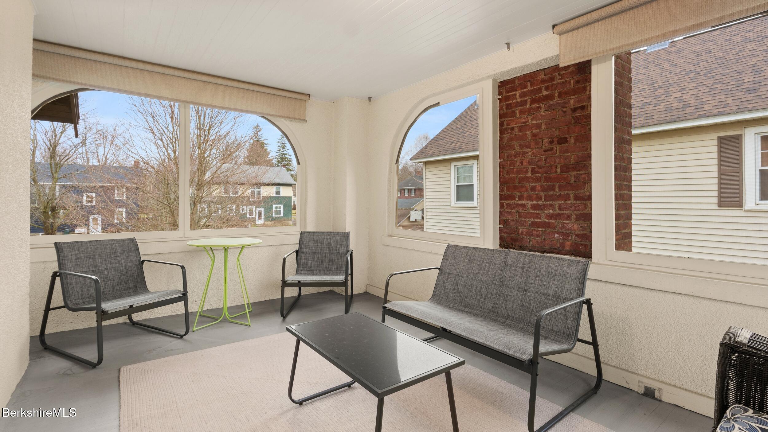 69 Commonwealth Avenue Pittsfield, MA 01201 - Photo 27 of 40 a living room with furniture and a large window