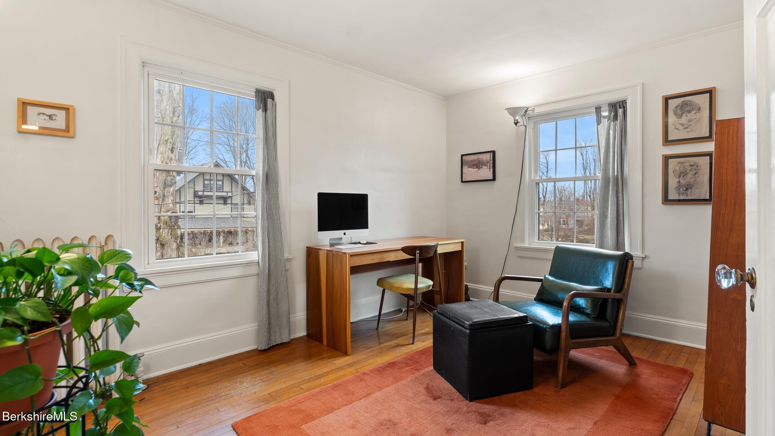 69 Commonwealth Avenue Pittsfield, MA 01201 - Photo 31 of 40 a living room with furniture and a window