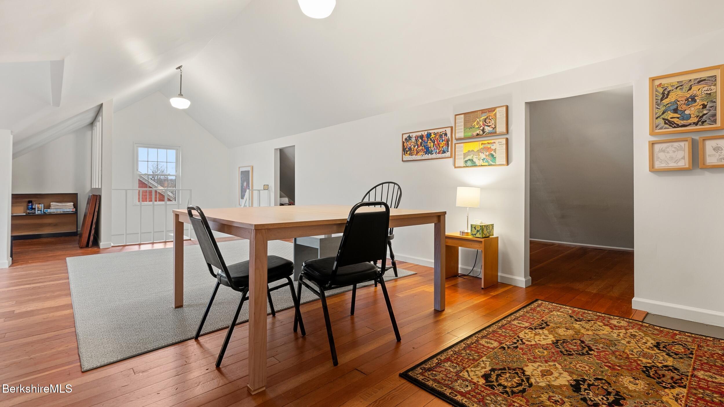 69 Commonwealth Avenue Pittsfield, MA 01201 - Photo 38 of 40 a view of a dining room with furniture and wooden floor