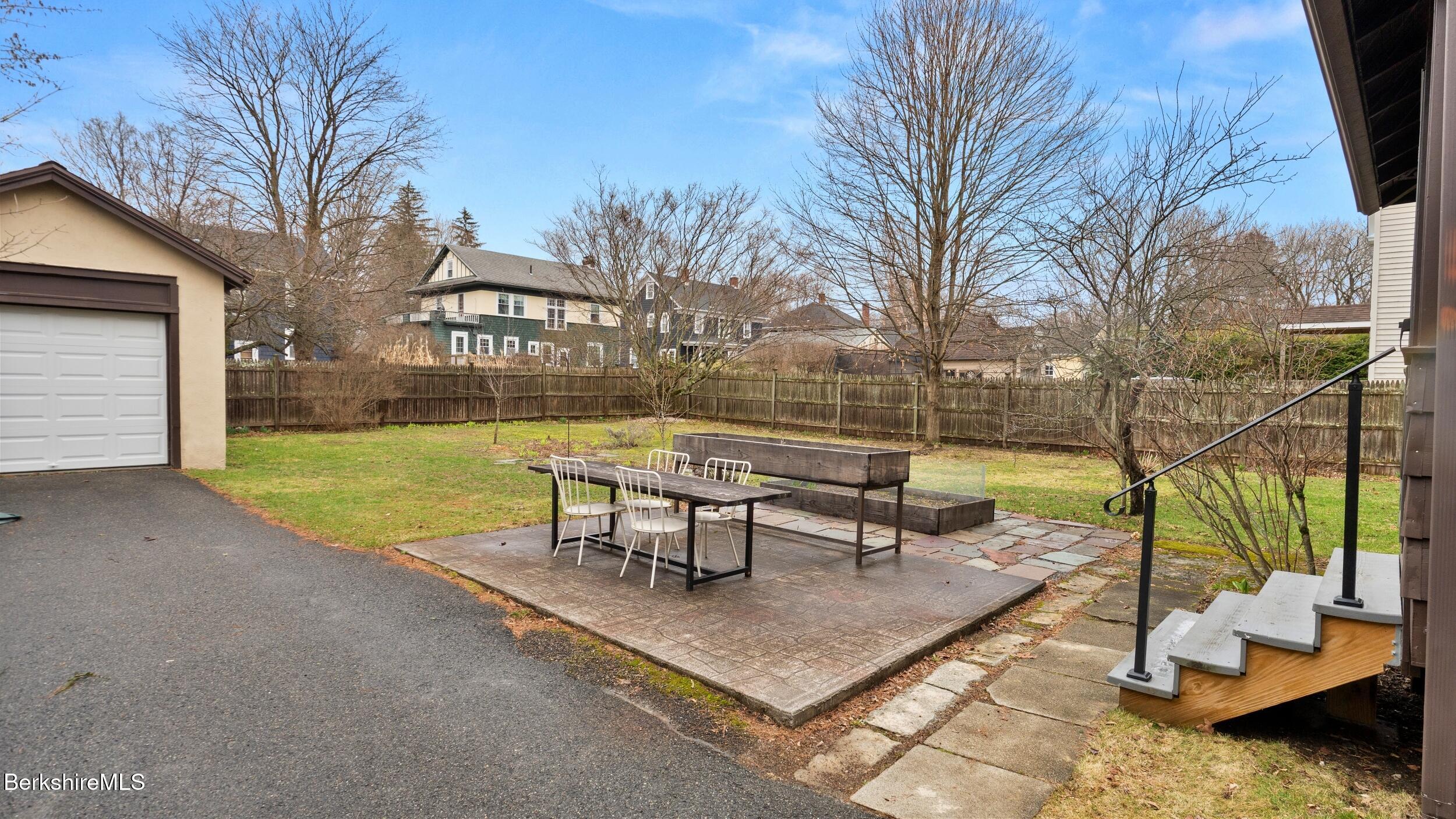 69 Commonwealth Avenue Pittsfield, MA 01201 - Photo 6 of 40 a view of a park with bench and trees