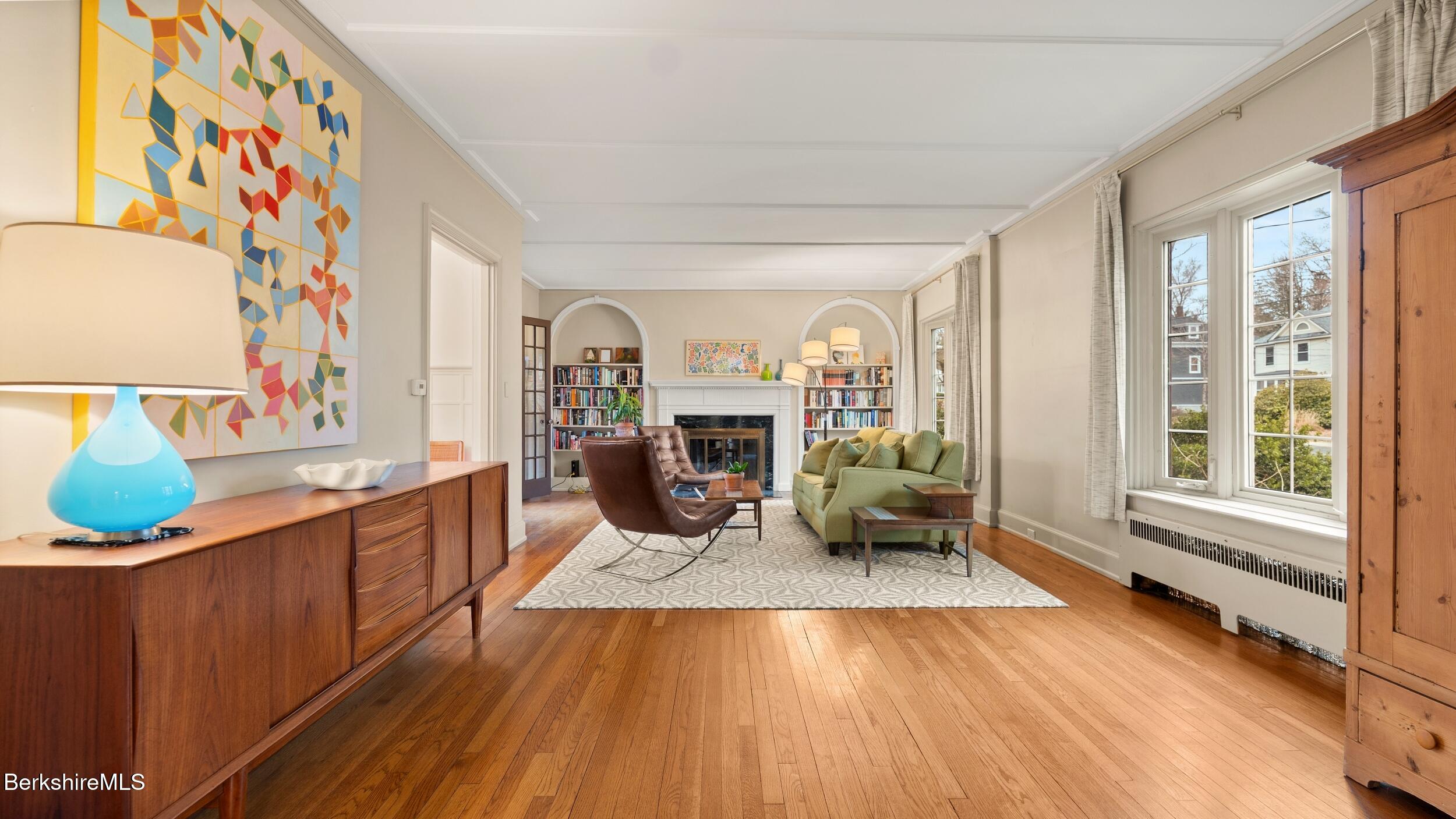 69 Commonwealth Avenue Pittsfield, MA 01201 - Photo 8 of 40 a living room with furniture and a fireplace