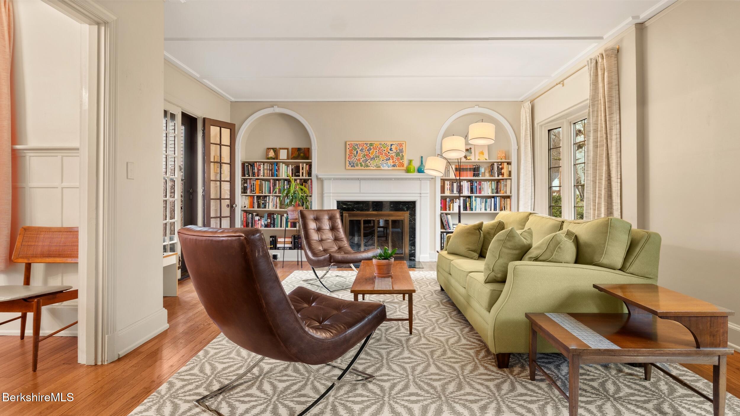 69 Commonwealth Avenue Pittsfield, MA 01201 - Photo 9 of 40 a living room with furniture fireplace and a window