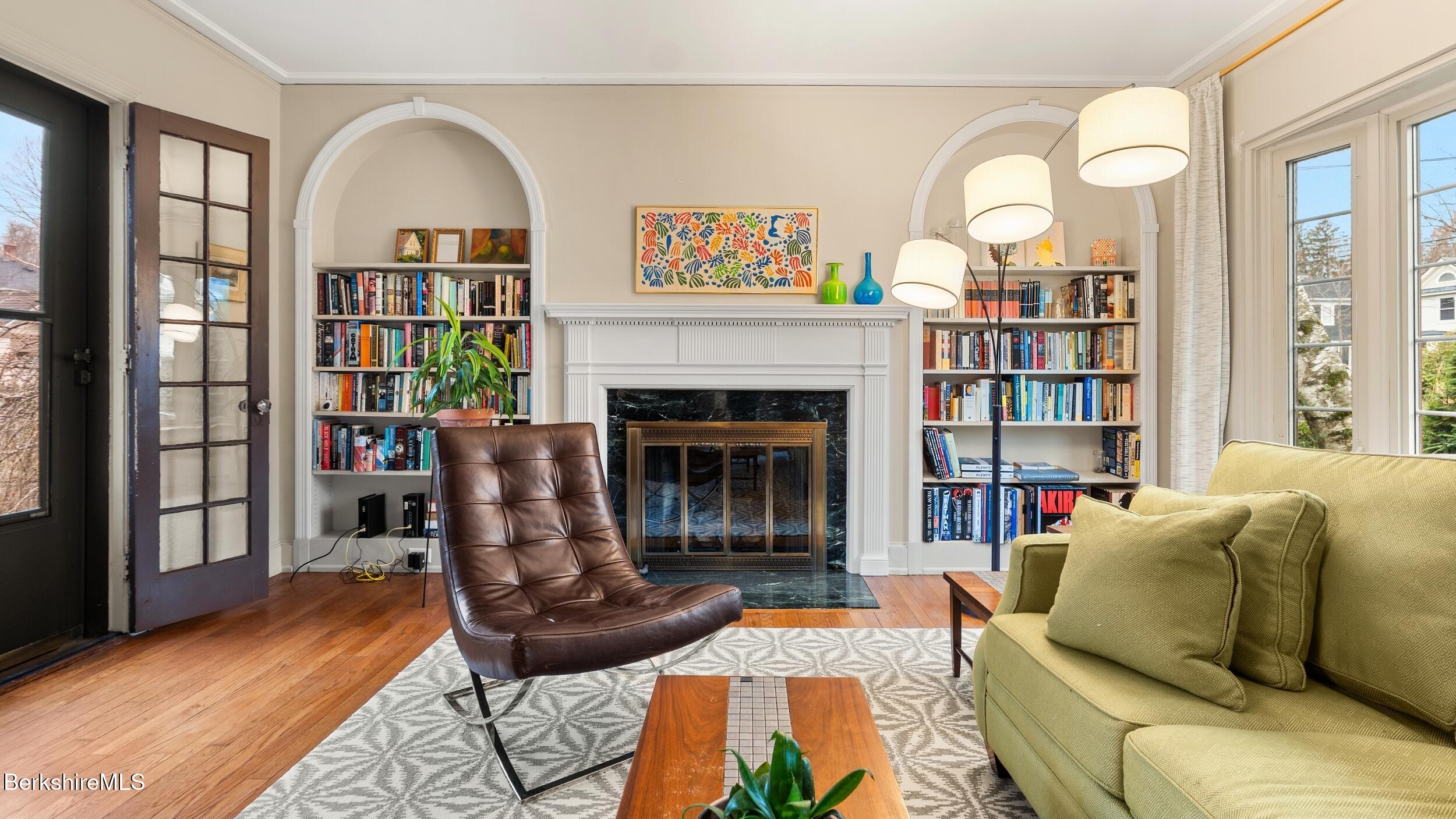 69 Commonwealth Avenue Pittsfield, MA 01201 - Photo 10 of 40 a living room with furniture and a fireplace