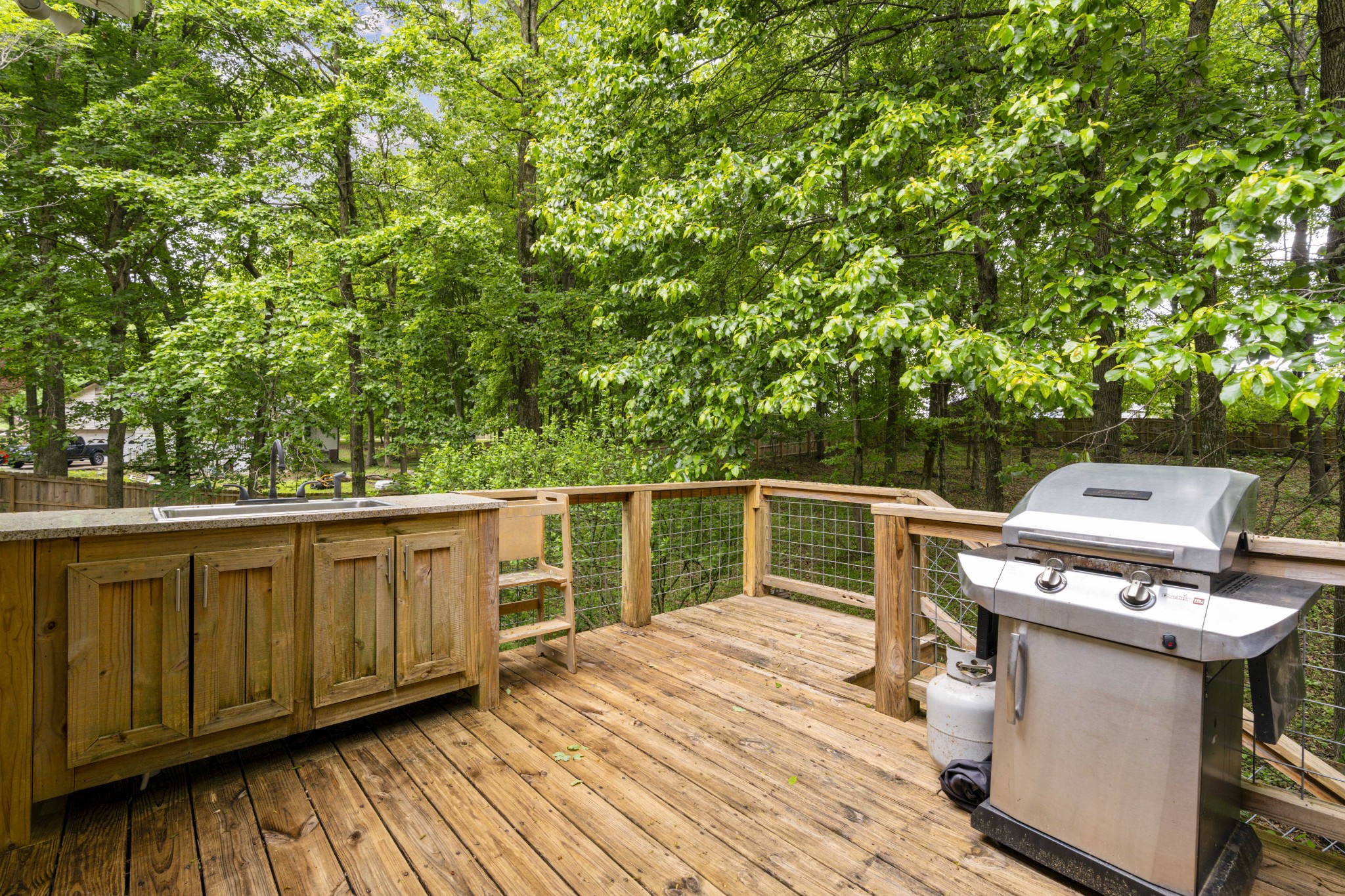 7339 Chowning Road Springfield, TN 37172 - Photo 47 of 57 a view of a balcony with wooden floor and outdoor seating