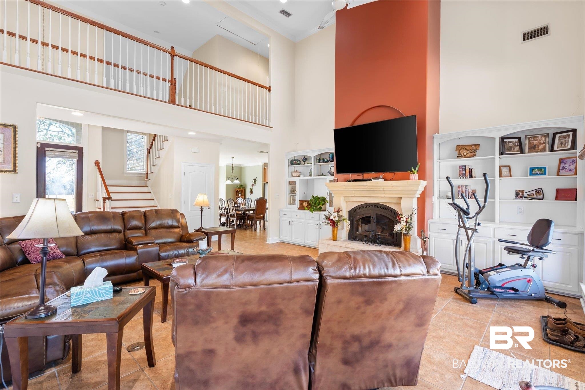 15635 County Road 83 Elberta, AL 36530 - Photo 6 of 54 Tiled living room with built in shelves and a high ceiling