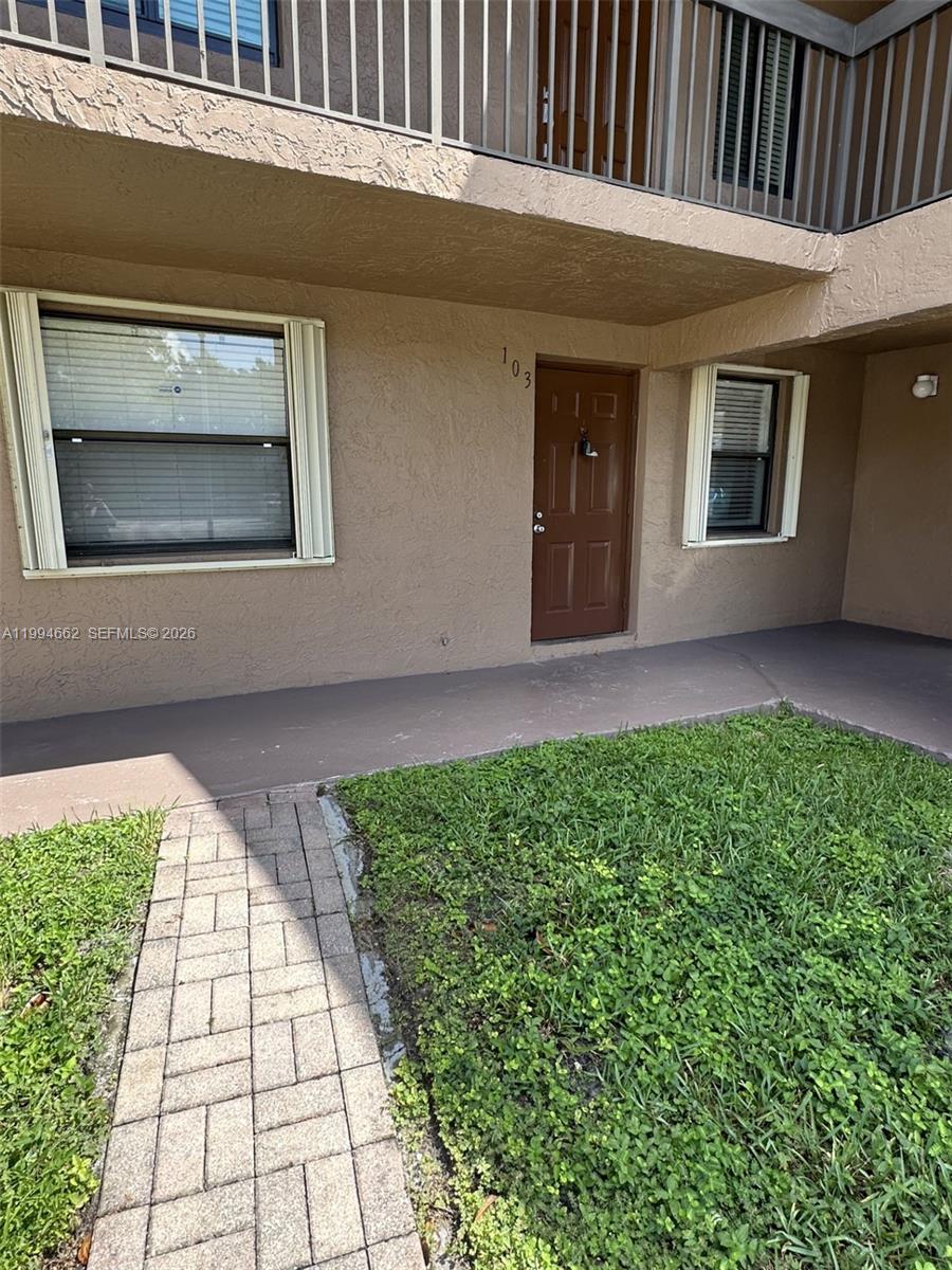 10003 Winding Lake Road, Unit 103 Sunrise, FL 33351 - Photo 1 of 12 a view of front door of house
