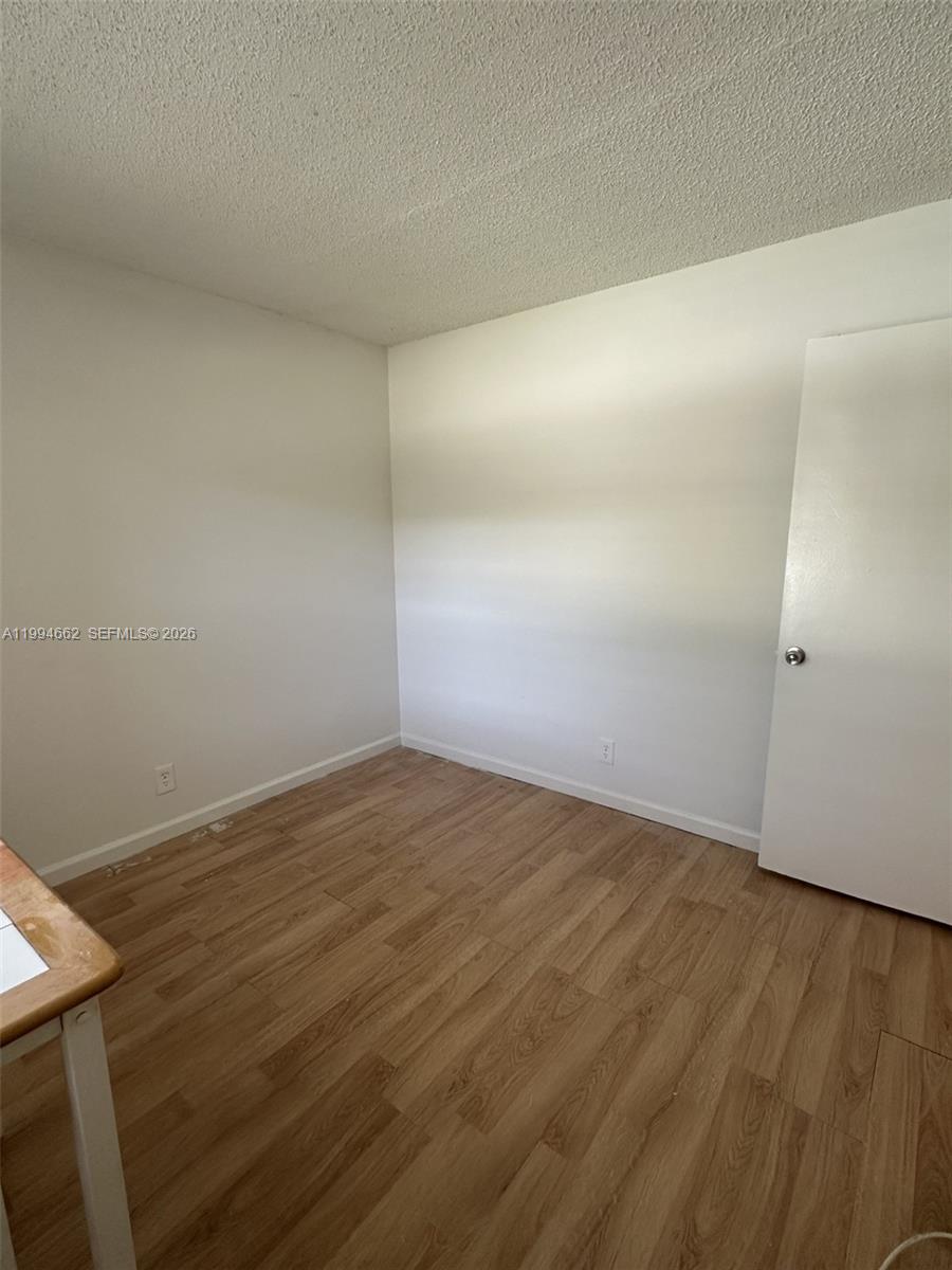 10003 Winding Lake Road, Unit 103 Sunrise, FL 33351 - Photo 5 of 12 a view of an empty room