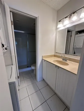 a bathroom with a sink a vanity and a mirror