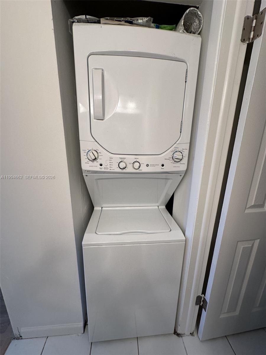 10003 Winding Lake Road, Unit 103 Sunrise, FL 33351 - Photo 10 of 12 a utility room with dryer and washer