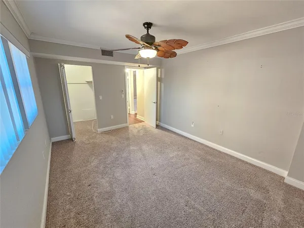 a view of an empty room with a window