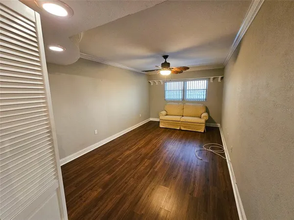 wooden floor in a hall with a window