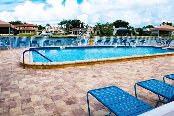 a view of swimming pool with outdoor seating