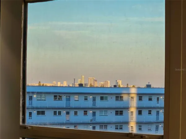 a view of a tall building from a balcony