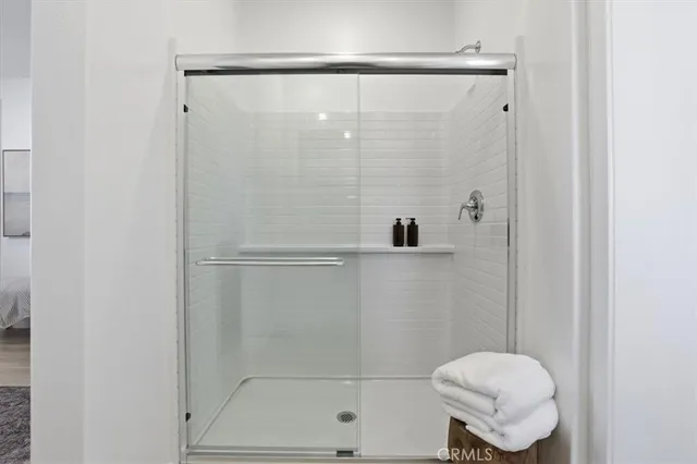 a bathroom with a shower and toilet