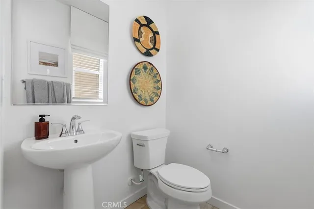 a bathroom with a toilet and a sink