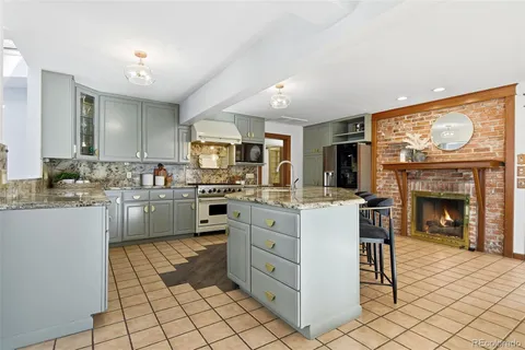 a living room with furniture and large windows