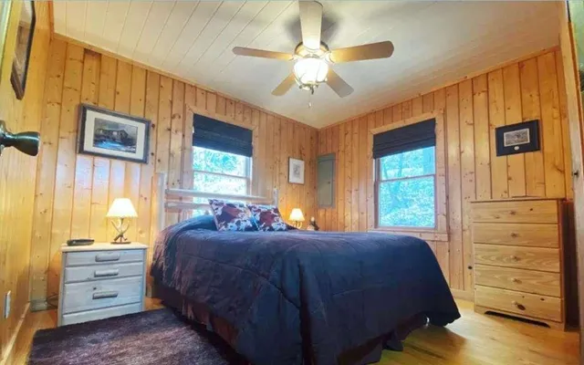 a bed room with a bed and a dresser
