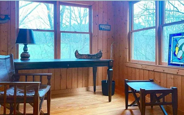a view of a dining room with furniture and window