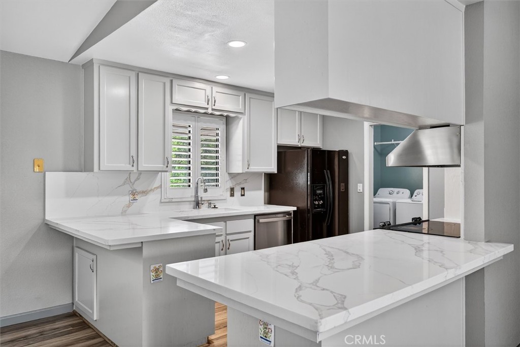 3310 Deer Run Road Mariposa, CA 95338 - Photo 13 of 47 a kitchen with a sink a refrigerator and a stove top oven