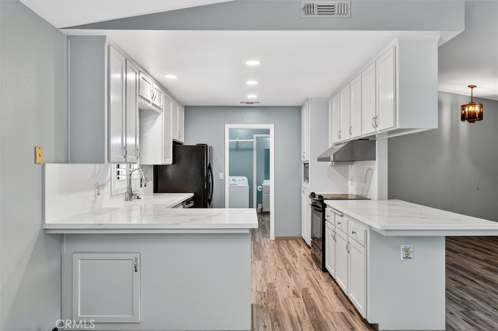 3310 Deer Run Road Mariposa, CA 95338 - Photo 14 of 47 a kitchen with a sink stove and refrigerator