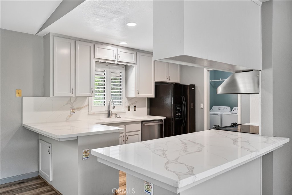 3310 Deer Run Road Mariposa, CA 95338 - Photo 15 of 47 a kitchen with a sink a refrigerator and a stove top oven