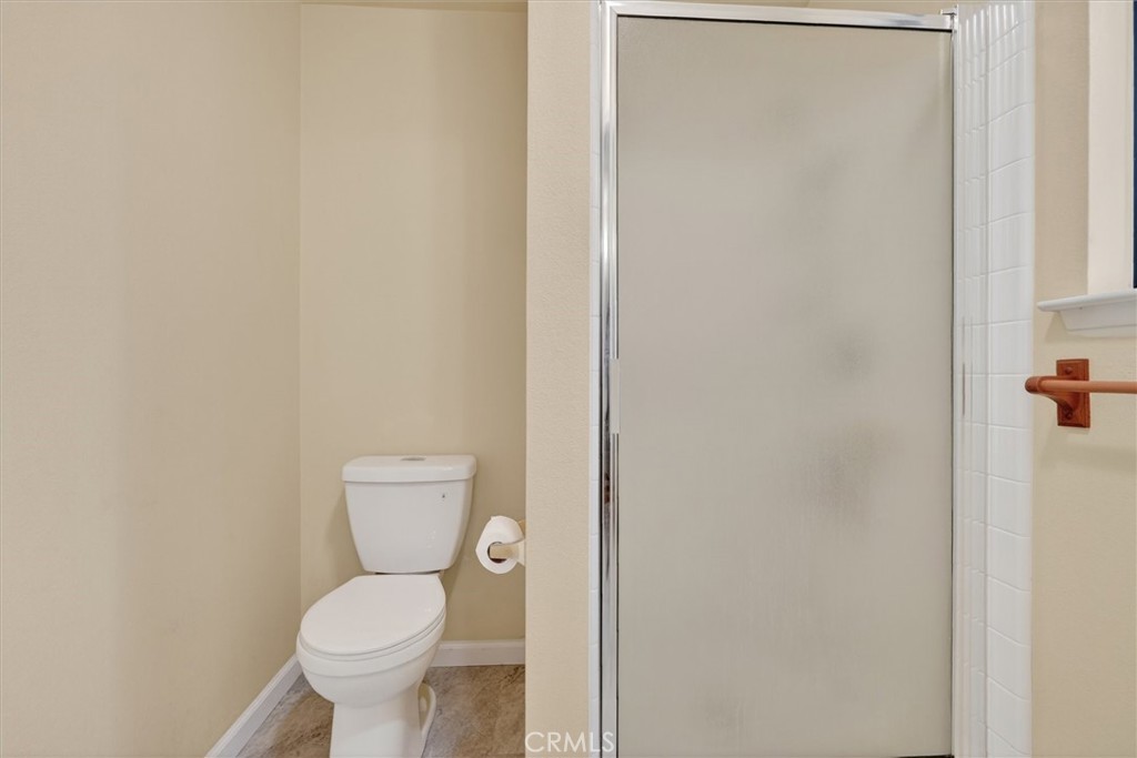 3310 Deer Run Road Mariposa, CA 95338 - Photo 25 of 47 a white toilet sitting next to a shower