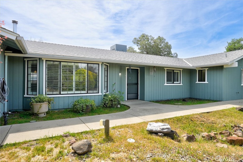 3310 Deer Run Road Mariposa, CA 95338 - Photo 4 of 47 a front view of a house with garden