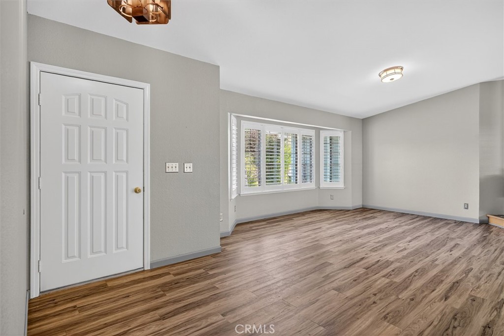3310 Deer Run Road Mariposa, CA 95338 - Photo 5 of 47 a view of an empty room with wooden floor and a window