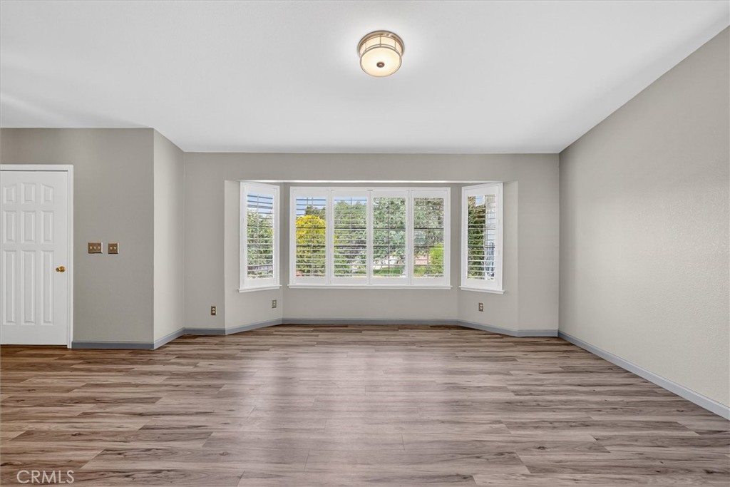 3310 Deer Run Road Mariposa, CA 95338 - Photo 7 of 47 a view of empty room with wooden floor and fan