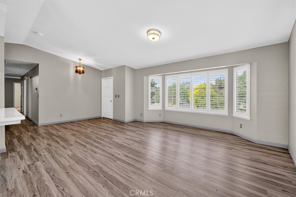 3310 Deer Run Road Mariposa, CA 95338 - Photo 8 of 47 a view of an empty room with wooden floor and a window
