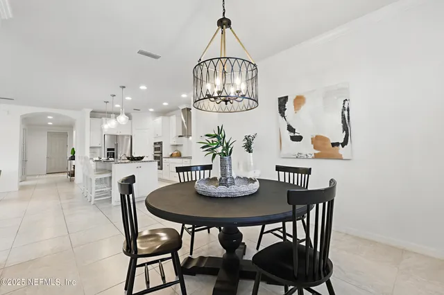 a spacious bedroom with a bed and a large window