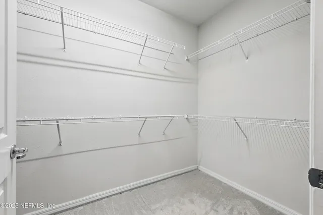 a view of an outdoor sitting area with furniture and umbrella